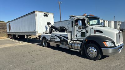 Eagle Towing Truck with White Car on the Back — Lockouts in Sacramento, CA Eagle Towing Truck with White Car on the Back — Lockouts in Sacramento, CA