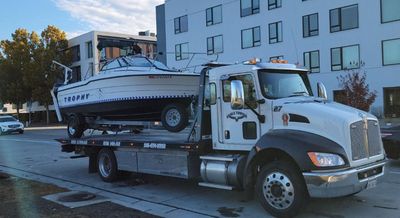 Eagle Towing Truck with White Car on the Back — Lockouts in Sacramento, CA Eagle Towing Truck with White Car on the Back — Lockouts in Sacramento, CA