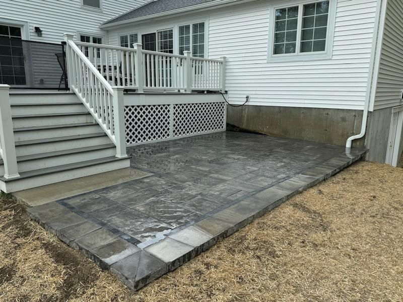 A White House With A Patio And Stairs | Husdon Valley, NY | Bastian Lawn and Landscape, LLC