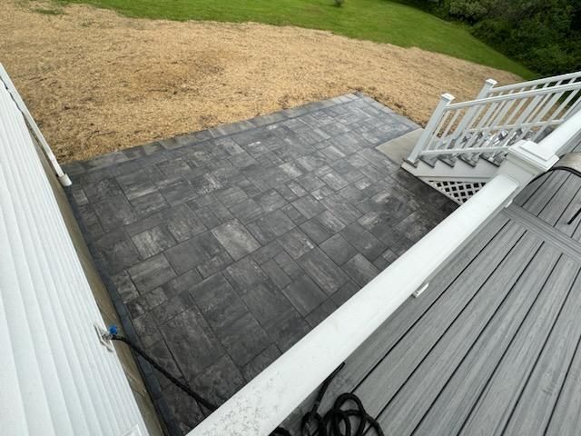 A Deck With Stairs Leading Up To It And A White Railing | Husdon Valley, NY | Bastian Lawn and Landscape, LLC