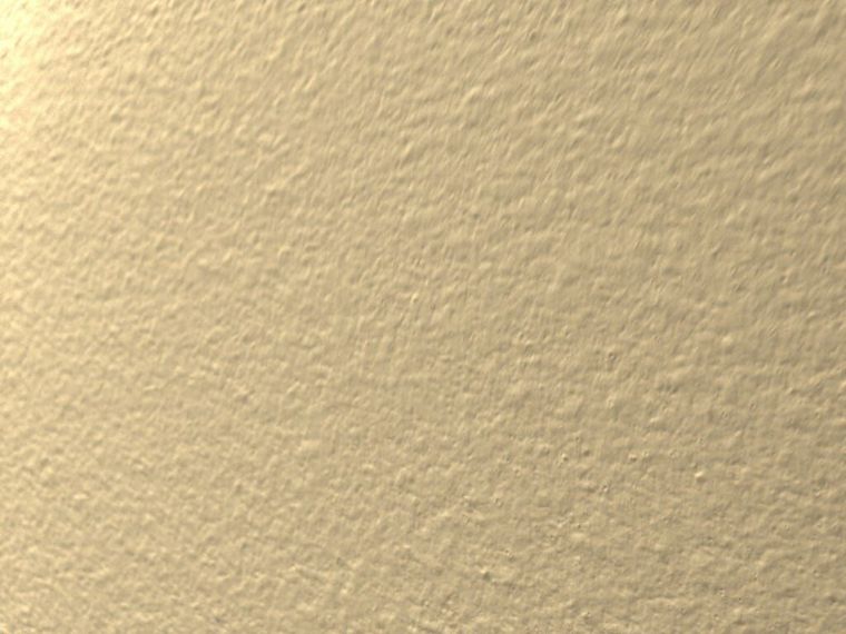A close up of a piece of paper with a grainy texture.