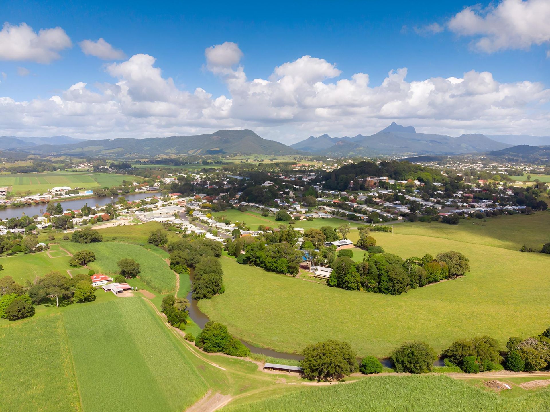 Aerial View of a Rural Town With Green Fields, a River — Intolec Electrical In Murwillumbah, NSW
