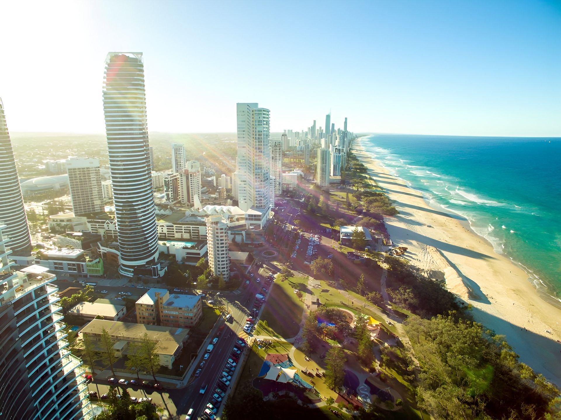 City Skyline With Skyscrapers Next to a Sandy Beach and Turquoise Ocean — Intolec Electrical In Gold Coast, QLD