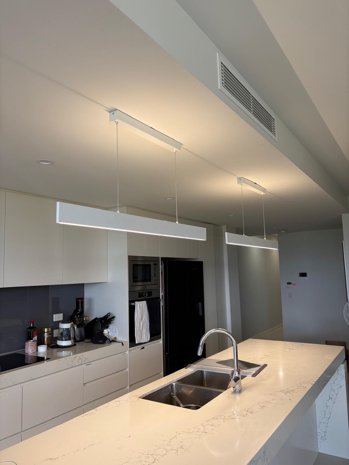 Modern Kitchen With White Countertops — Intolec Electrical in Tweed Heads, NSW