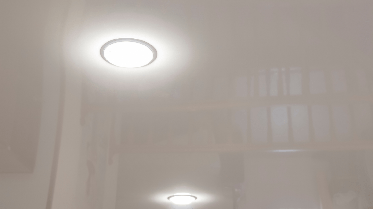 Two recessed ceiling lights illuminate a white hallway — Intolec Electrical In Tweed Heads, NSW