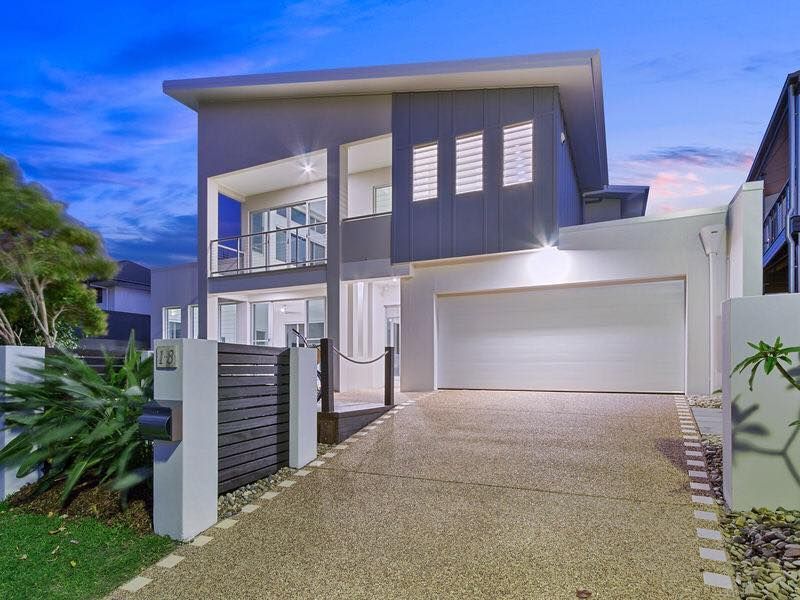 Modern Two-story House With Grey Siding, Garage, and Gravel Driveway — Intolec Electrical In Tweed Heads, NSW