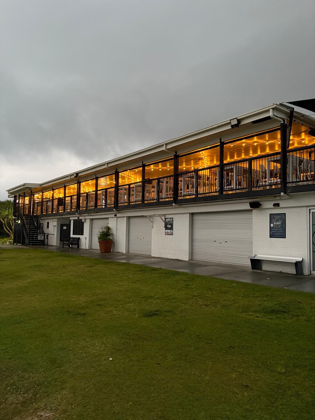 A Two-story White Building, Lit With String Lights — Intolec Electrical in Tweed Heads, NSW
