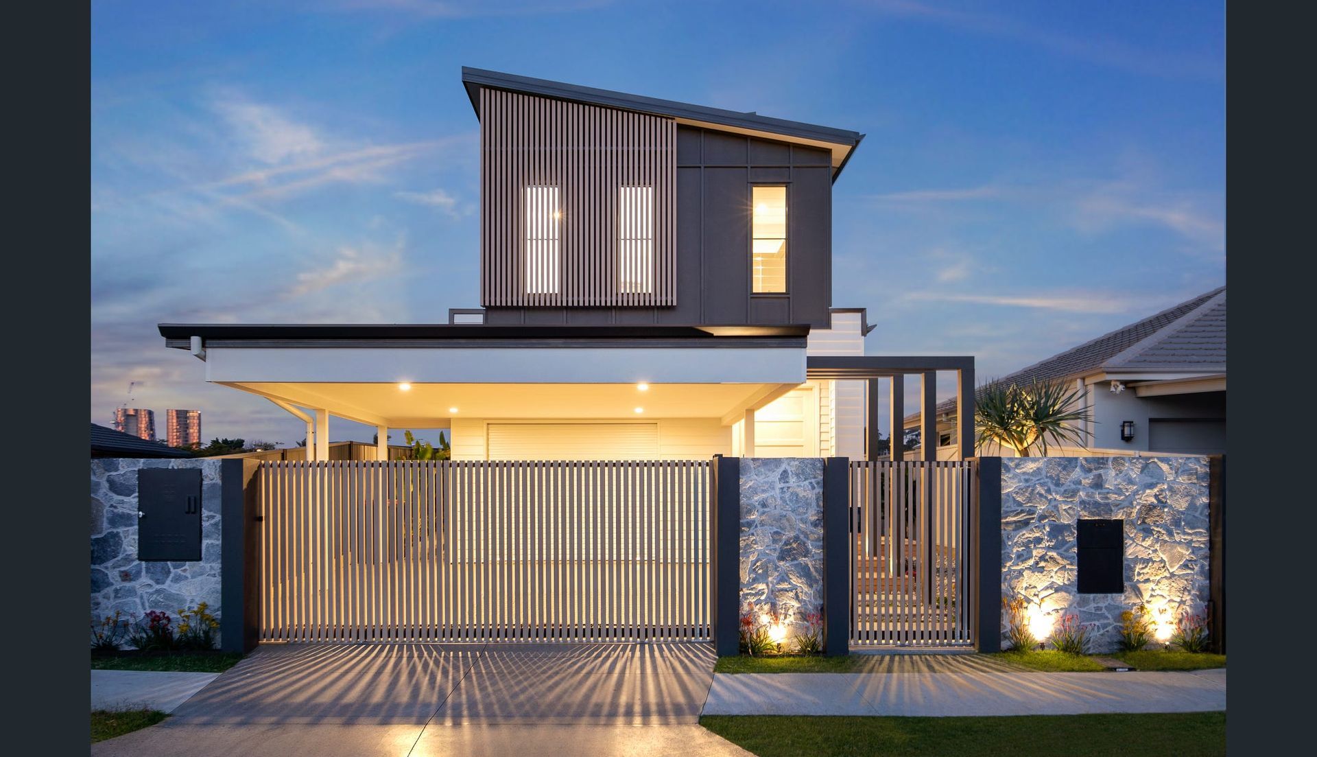 Modern House With Gray and White Facade, Metal Gate, and Outdoor Lighting — Intolec Electrical in Tweed Heads, NSW