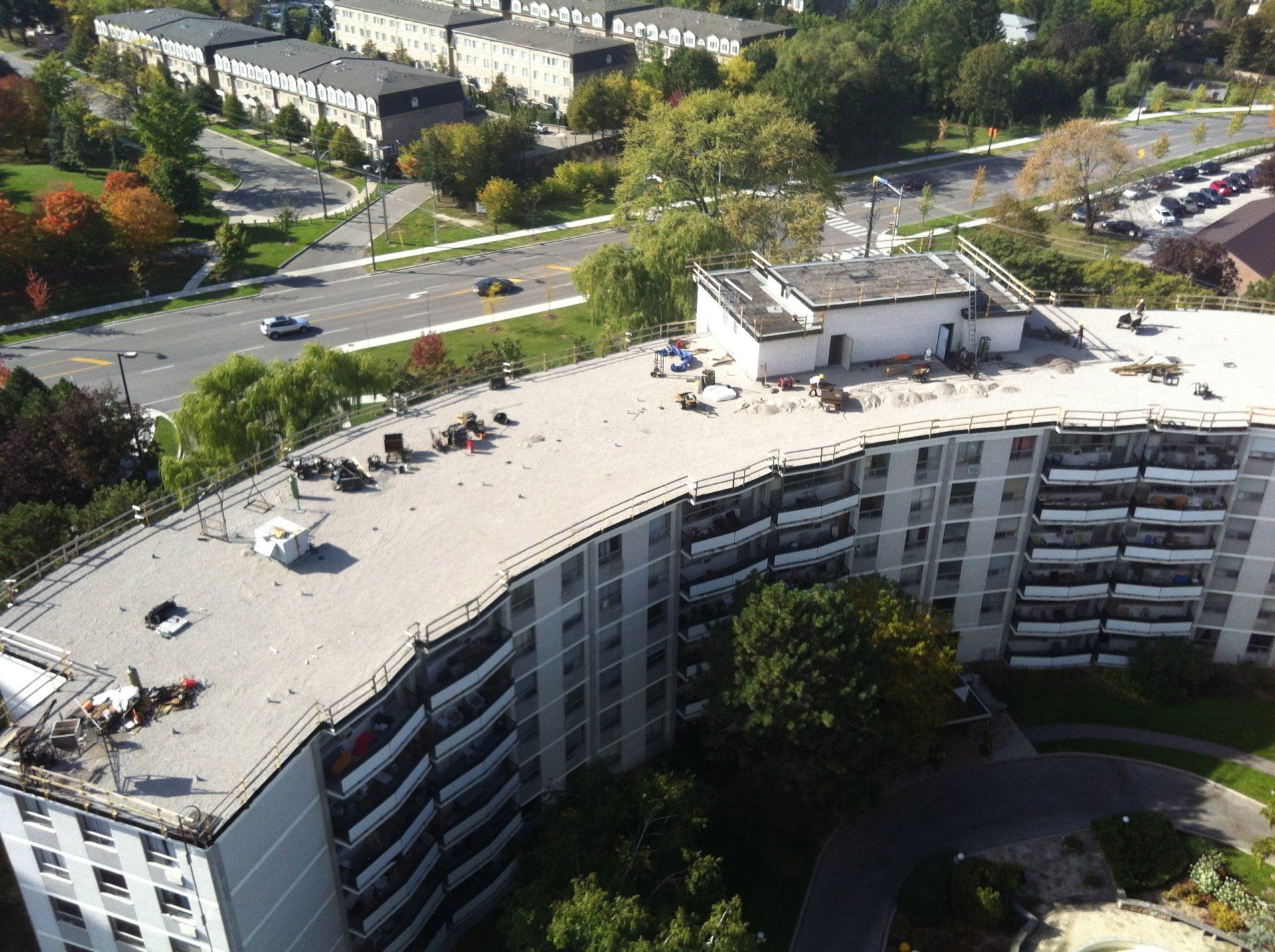 An aerial view of a large building with a curved roof