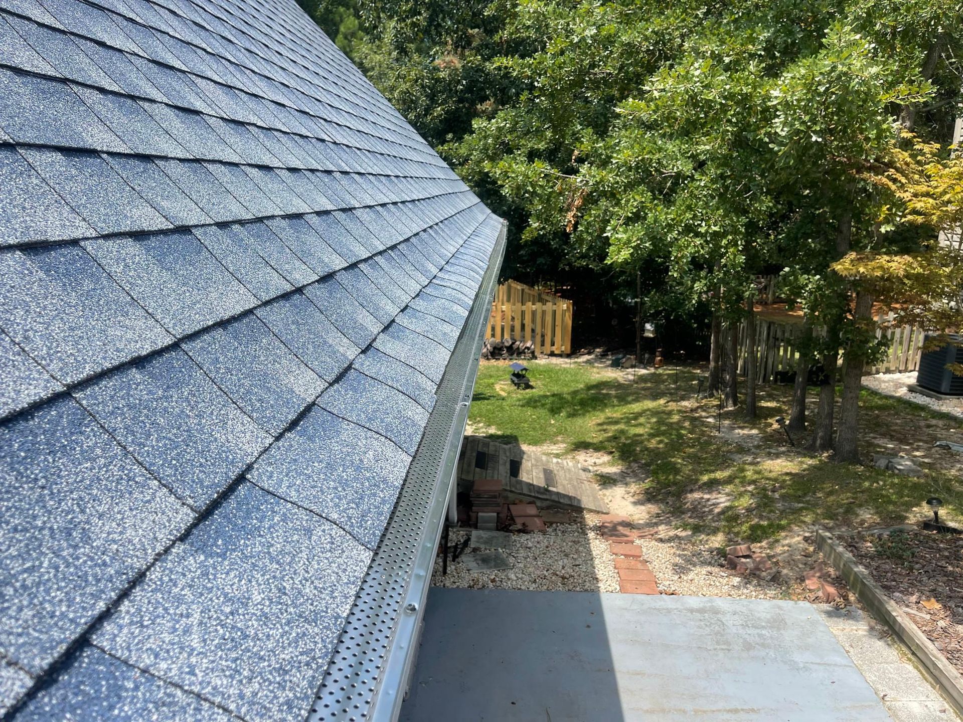 A close up of a roof with a gutter on it.