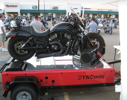 Powersports workshop showing ATV, snowmobile, and jet ski