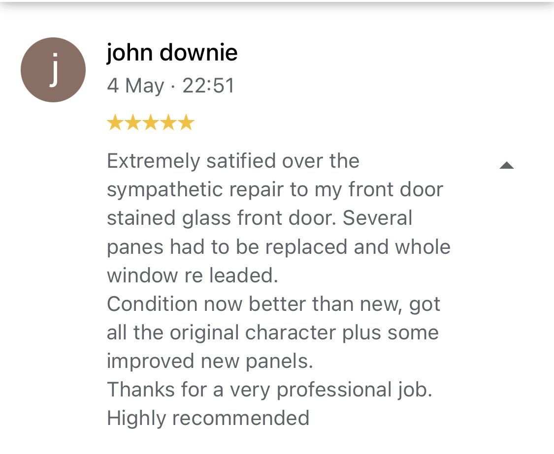 Google review screenshot praising front door repair and replacement panels, 5-star rating by John Downie