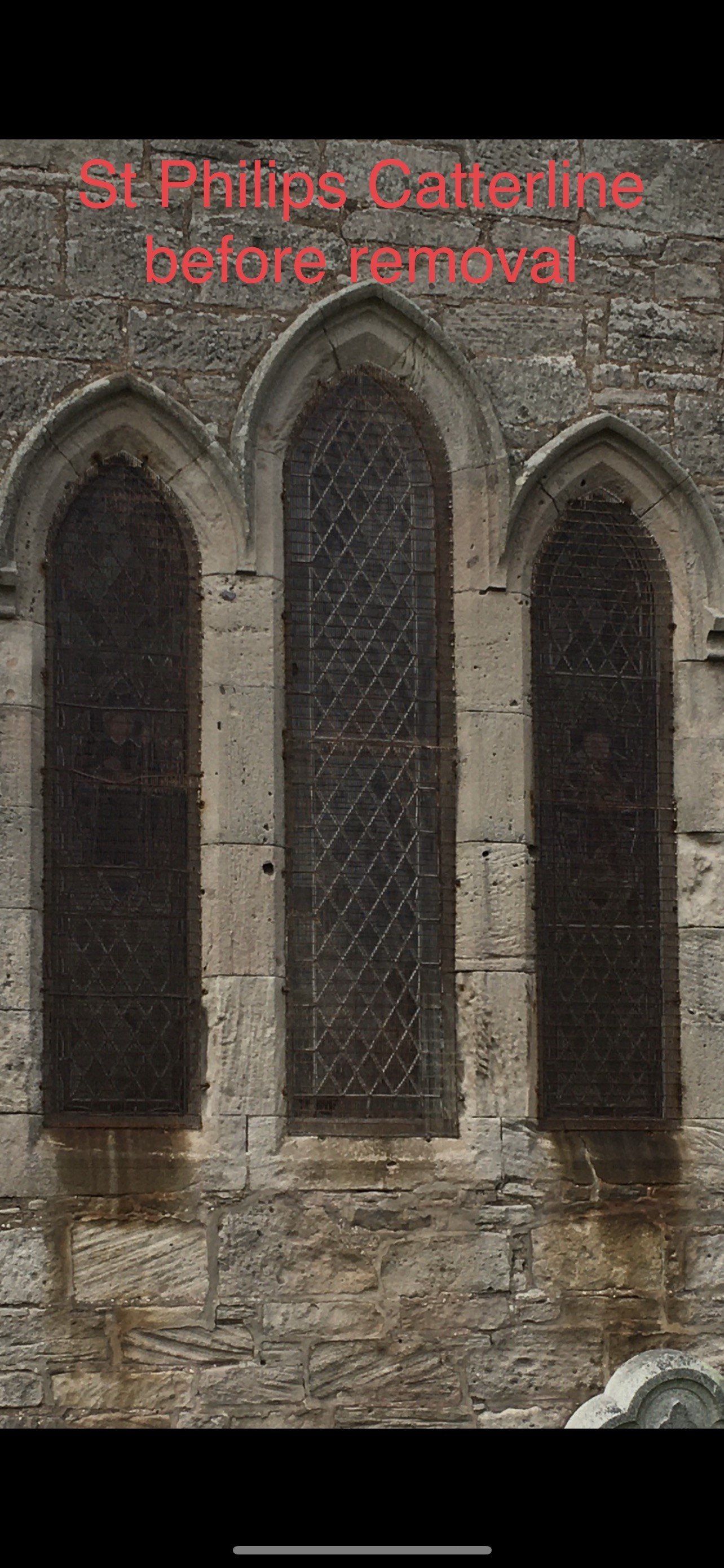 Stone church window with three arched openings and red text reading “St Ritta’s Cemetery before removal.”