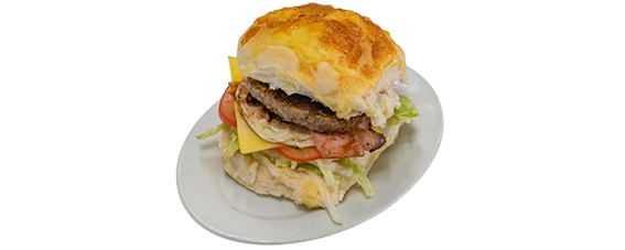 Hamburger with patty, cheese, tomato, and lettuce on a bun, on a white plate  — Henri's Wodonga Bakery in Wodonga, VIC