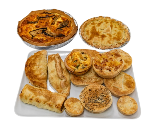 Assortment of savoury baked goods on a white platter, including pies and pastries — Henri's Wodonga Bakery in Wodonga, VIC