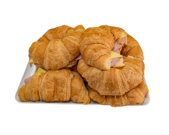 Croissant sandwiches on a white tray: ham and cheese fillings visible, golden-brown pastry  — Henri's Wodonga Bakery in Wodonga, VIC