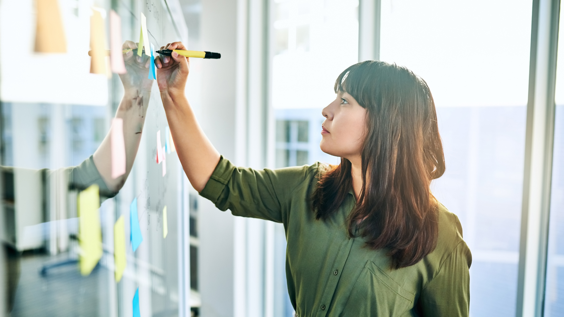 Woman writing on the board