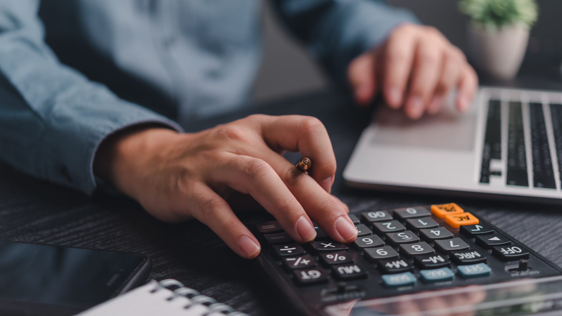 calculations on a laptop and calculator