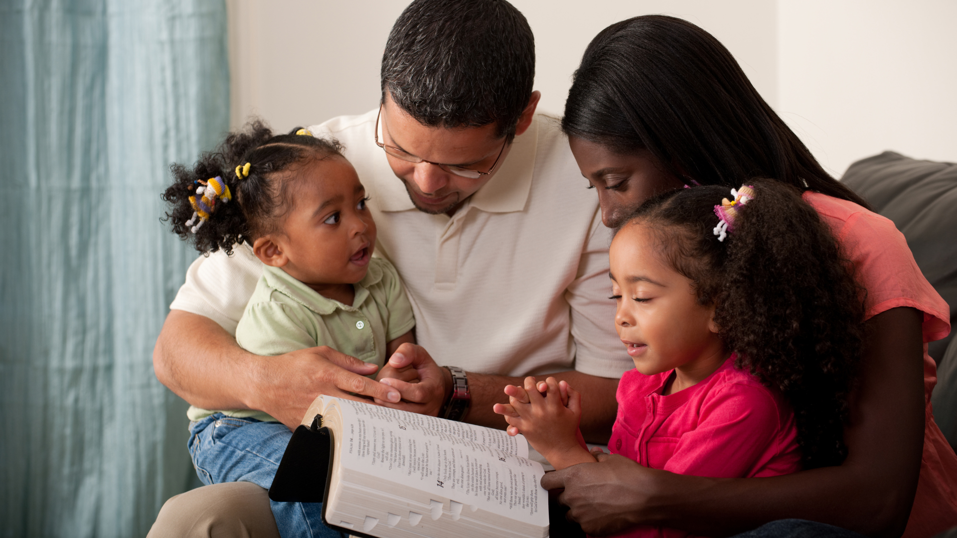 Tutor leading a small group lesson around a table in a cozy classroom.