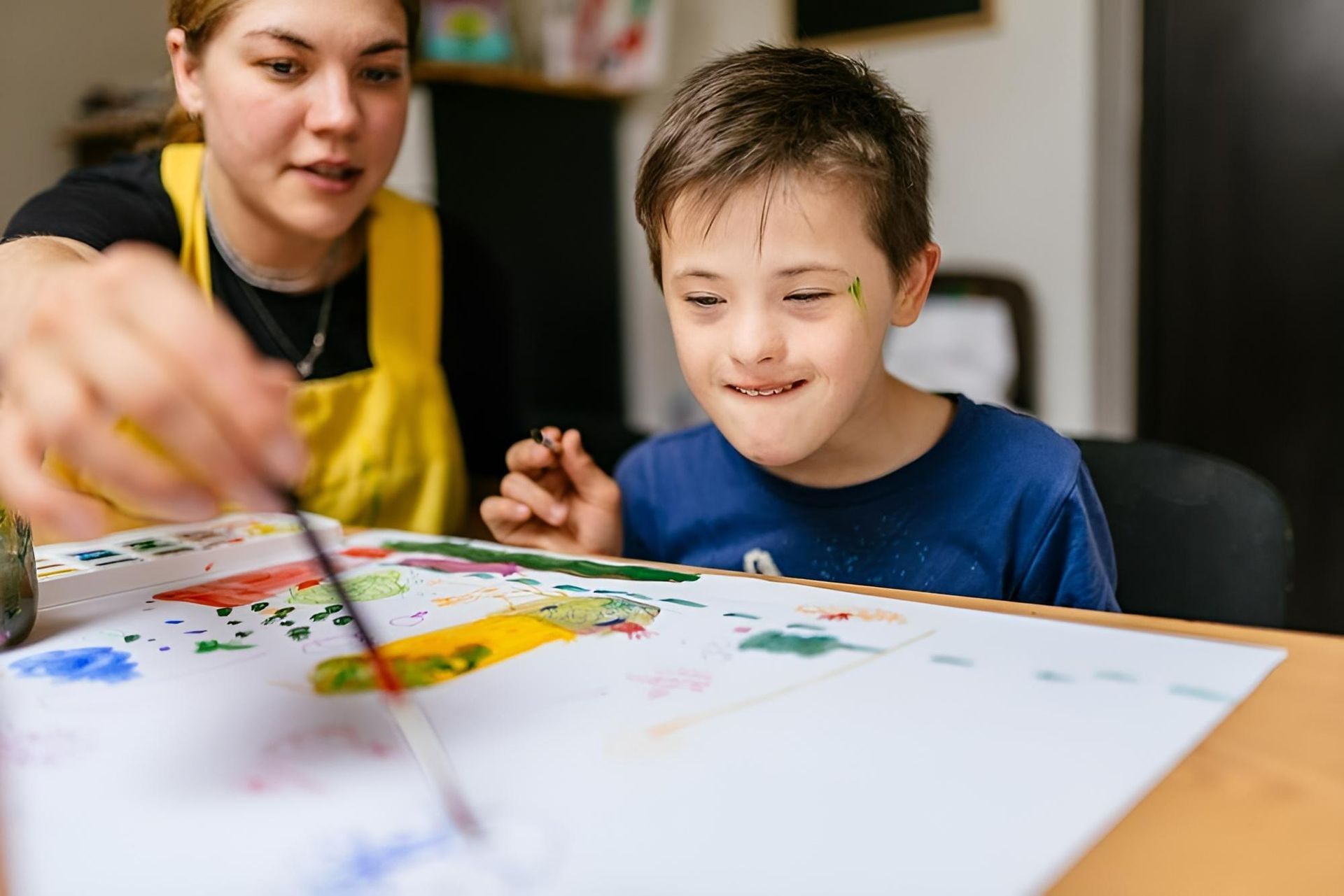 A Woman Helping a Young Boy — Oracle Psychology Child & Adolescent Psychologists Newcastle in Newcastle, NSW