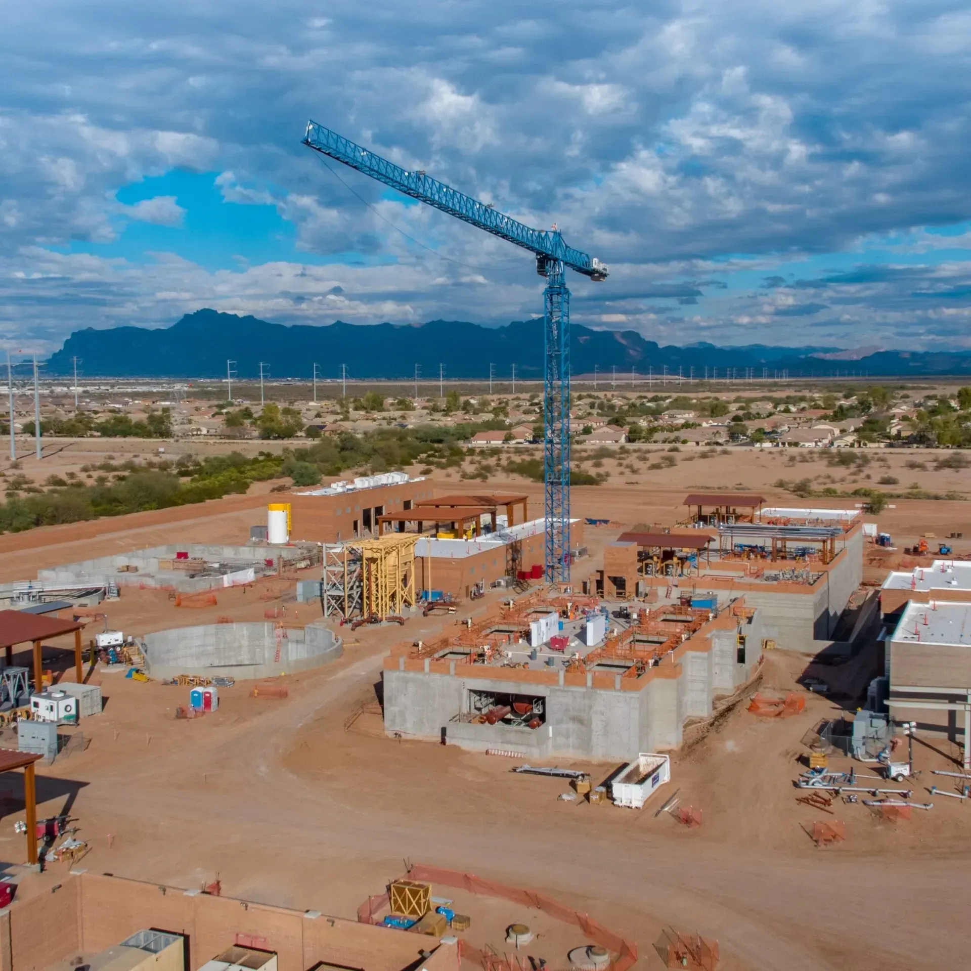 Photo by Phoenix Drone Pros, Robert Biggs, An aerial view of a construction site with mountains in the background