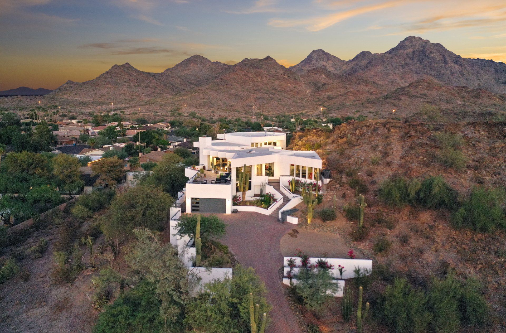 Photo by Phoenix Drone Pros, Robert Biggs, An aerial view of a large white house on top of a hill