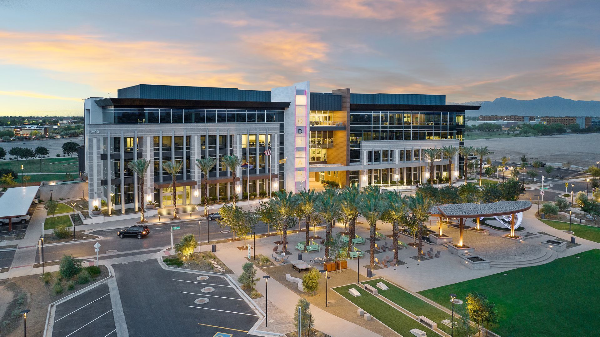 Drone photo for real estate Photo by Phoenix Drone Pros, Robert Biggs, An aerial view of a large building with palm trees in front of it.