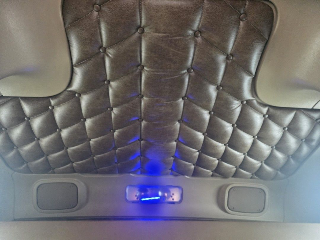 Tufted leather ceiling with LED lights in a semi truck sleeper cab in Largo, FL, before leather cleaning