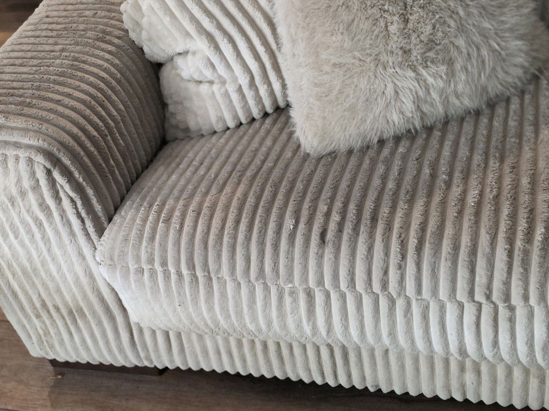 Close up of a heavily soiled white corduroy sofa cushion before upholstery cleaning in St. Petersburg, FL