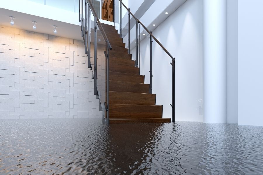 Standing water spreading across the floor of a commercial office in the Tampa Bay area after a pipe failure