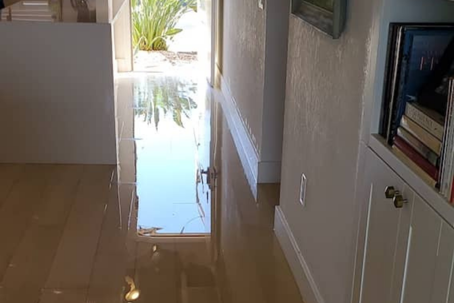 Flooded house interior showing standing water