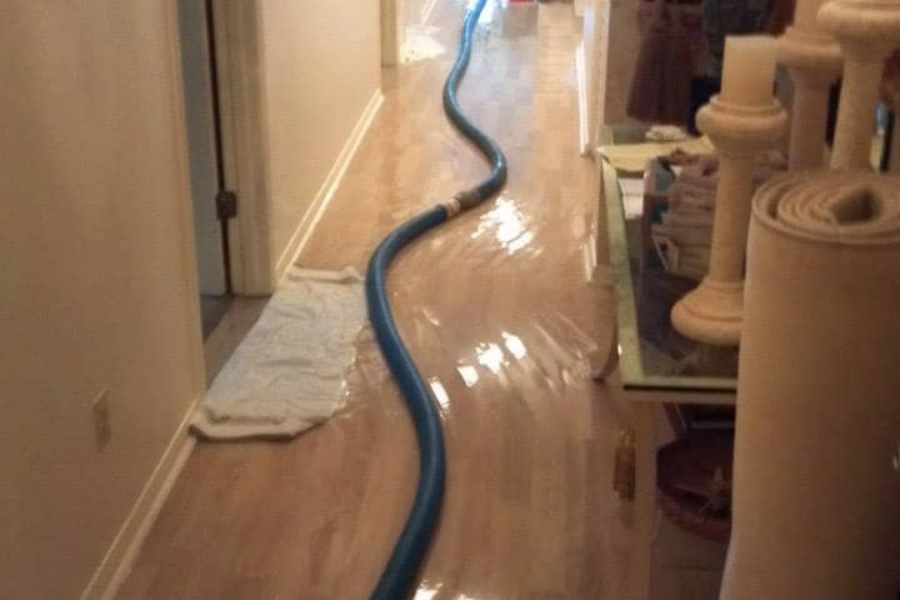 Professional water extraction equipment removing flood water