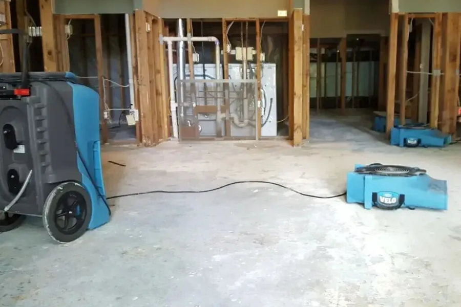 Professional water damage restoration equipment drying out a Tampa Bay home