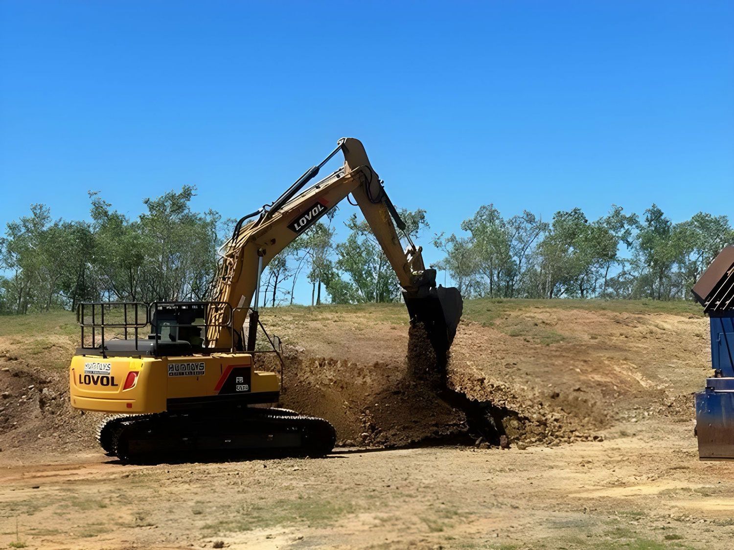 Yellow Excavator During An Excavation In Rockhampton