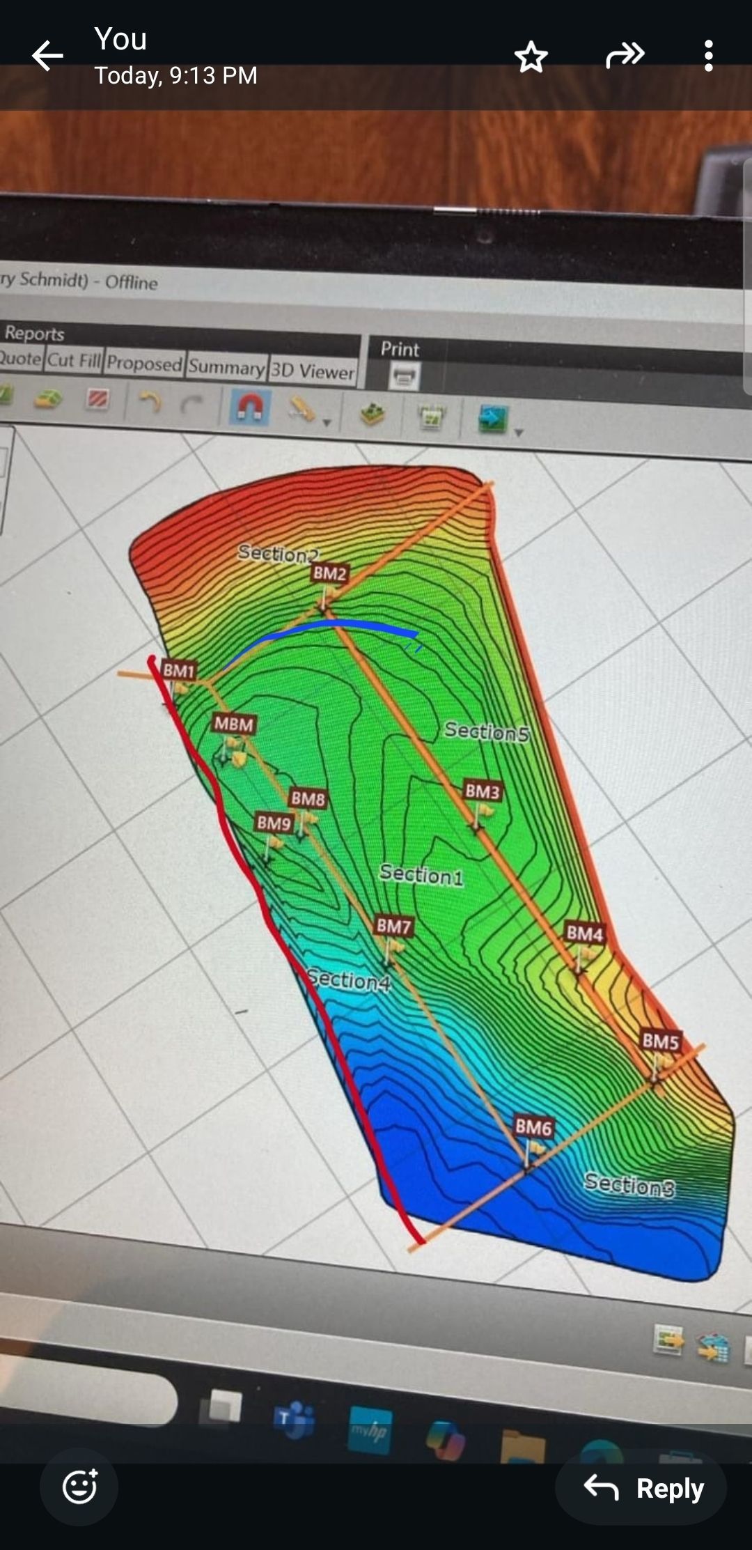 Colorful terrain heatmap on a monitor, with red, green, and blue elevation bands and contour lines.