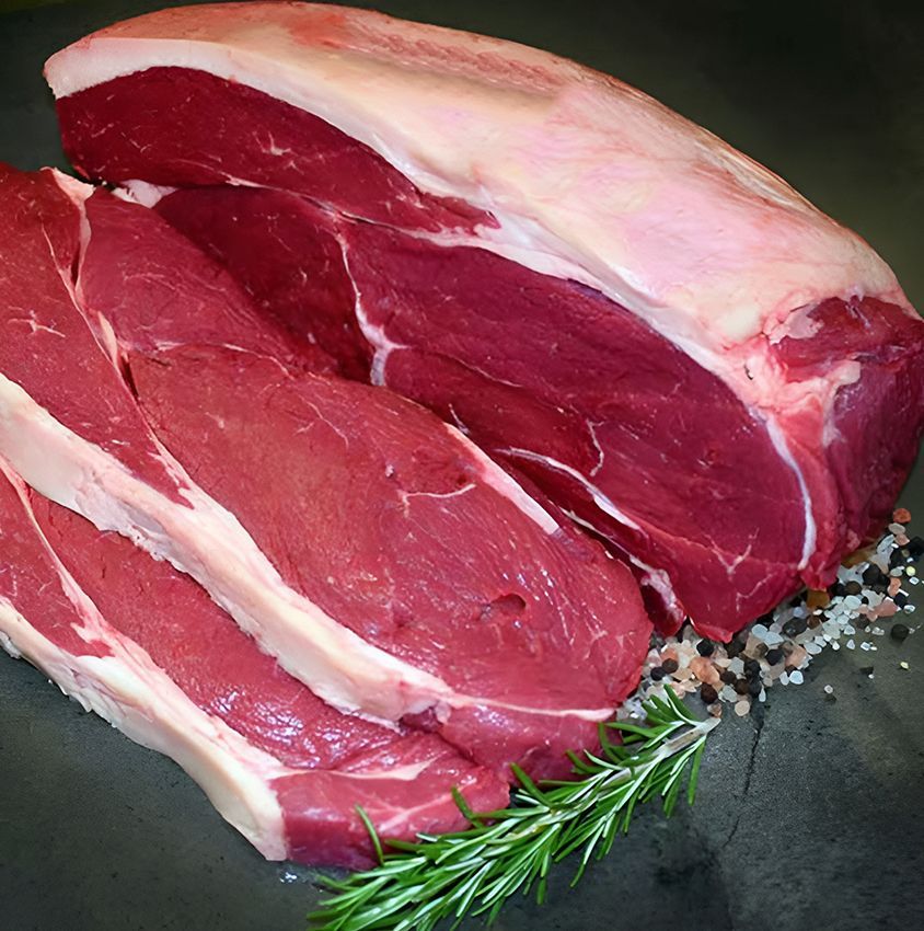 A Large Piece of Raw Beef with a Sprig of Rosemary — Midway Butchers in Innisfail, QLD