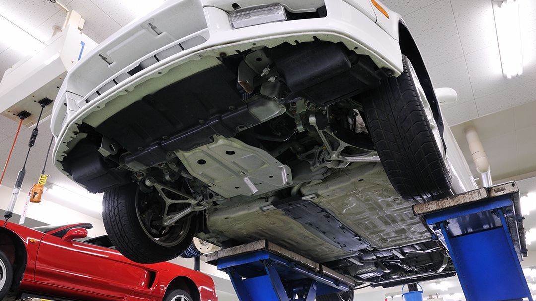 Vehicle Lifted for Undercarriage Inspection | Car Pro Auto Repair & Collision