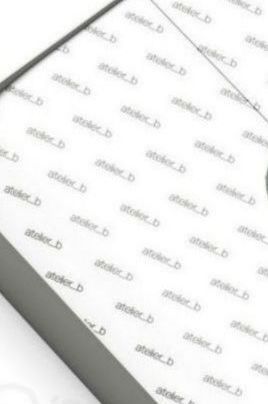 Close-up of a white surface with the repeated watermark