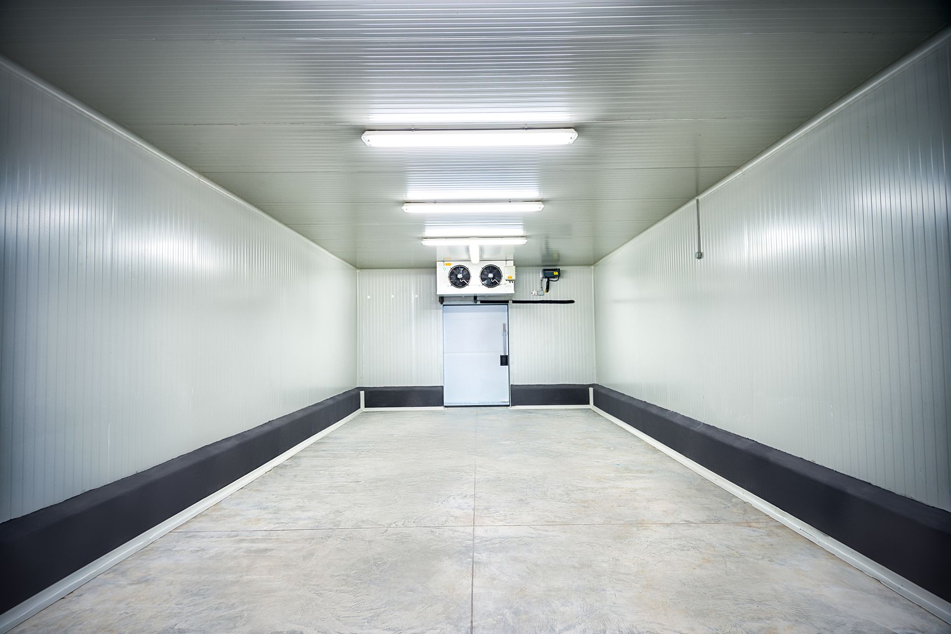 Commercial refrigeration equipment operating in a Philadelphia business during peak summer heat.