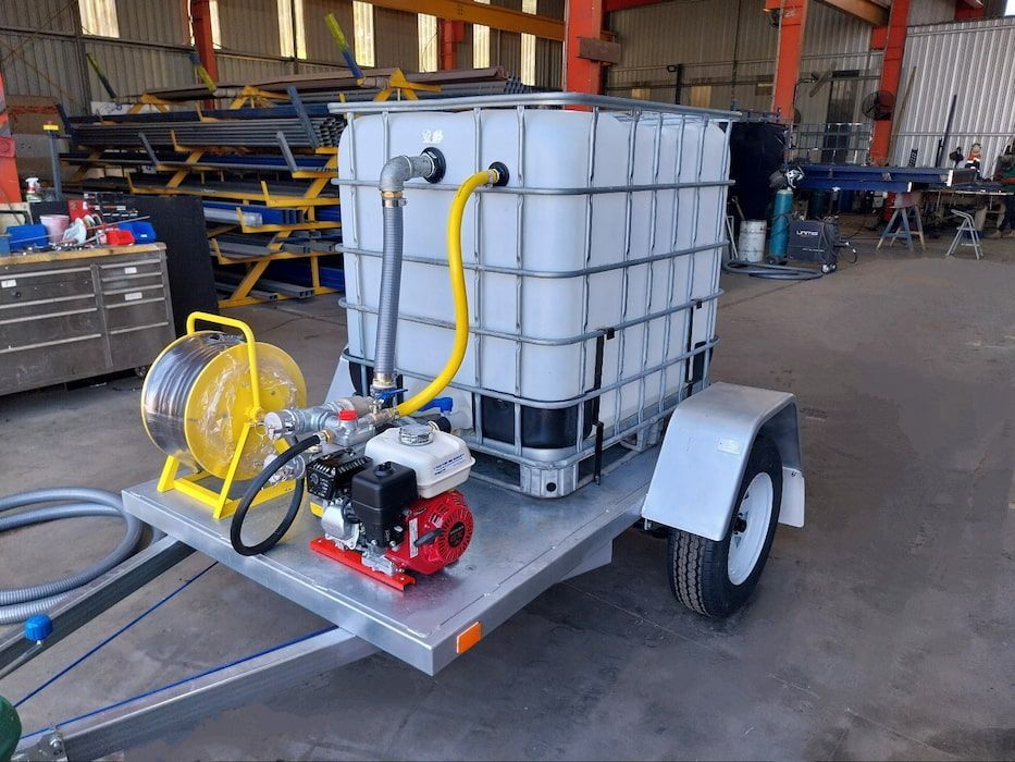 A Trailer with A Tank and A Pump Attached to It — Eddies Trailers & Fab in Armidale, NSW