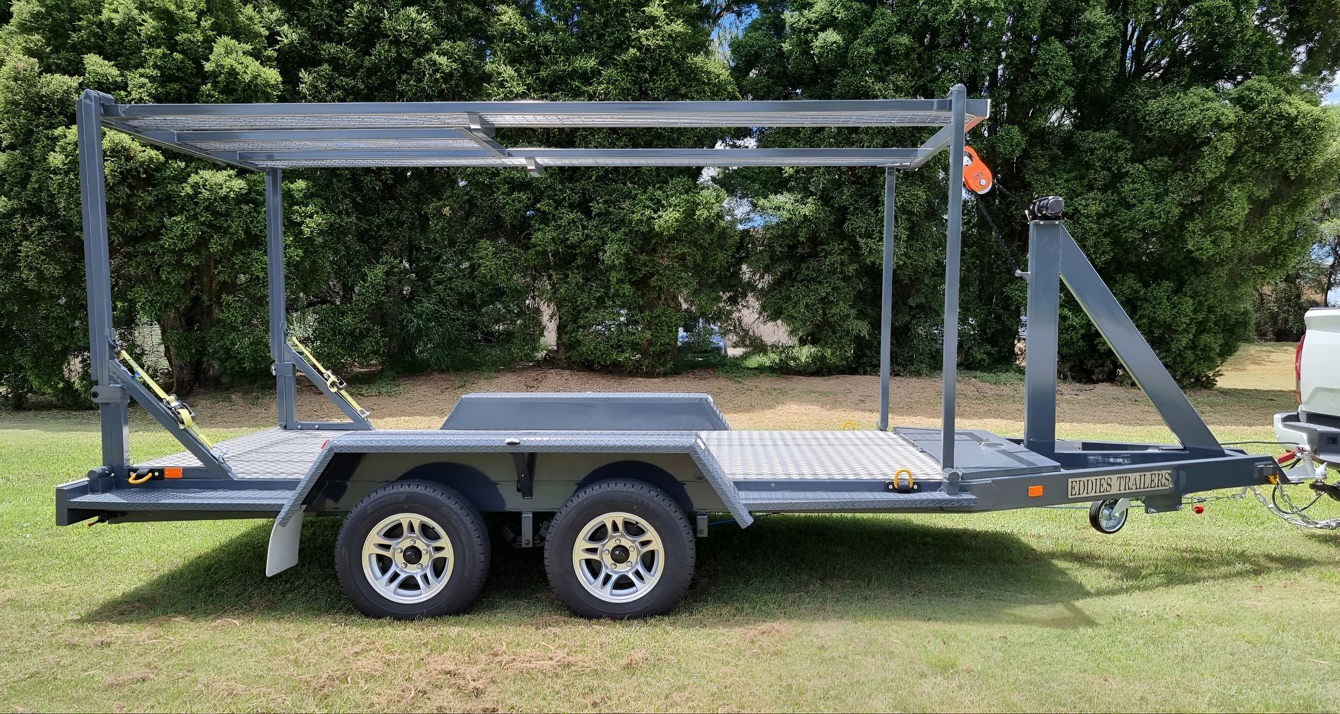 A Yellow Trailer Is Parked in Front of A Building — Eddies Trailers & Fab in Muswellbrook, NSW