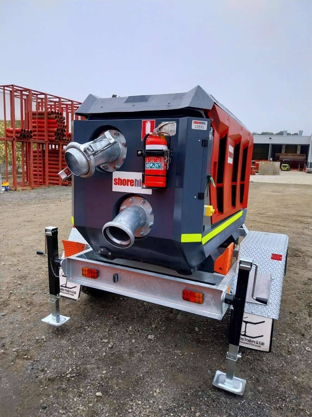 A Large Machine Is Sitting On Top Of A Trailer — Eddies Trailers & Fab in Moree, NSW