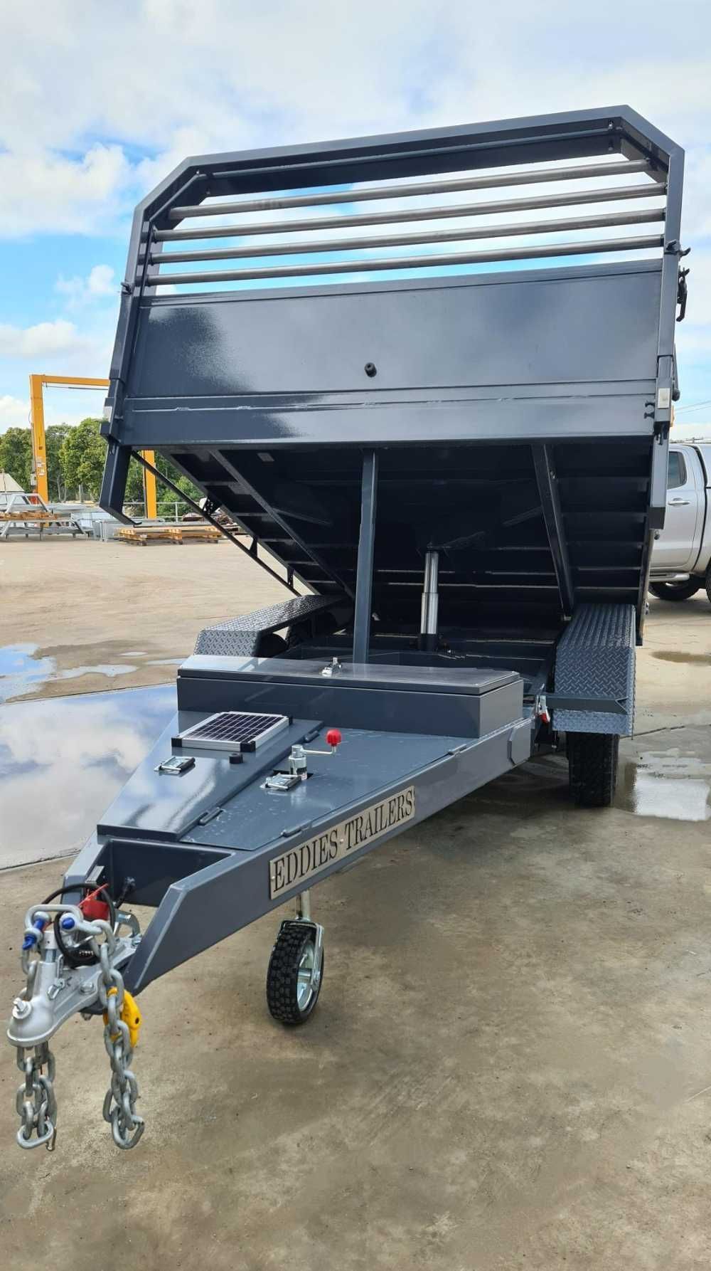 A Black Dump Trailer Is Parked In A Parking Lot — Eddies Trailers & Fab in Moree, NSW