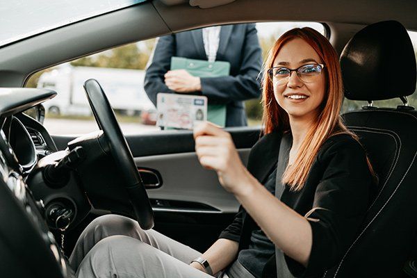Lady Showing Her Driver's License — Bob Shropshire Driving School — Cincinnati, OH Lady Showing Her Driver's License — Bob Shropshire Driving School — Cincinnati, OH