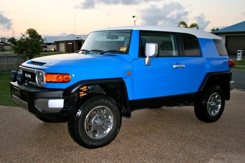 A Blue and White Suv is Parked in Front of a House — Mr Shiny Mechanical in Andergrove, QLD