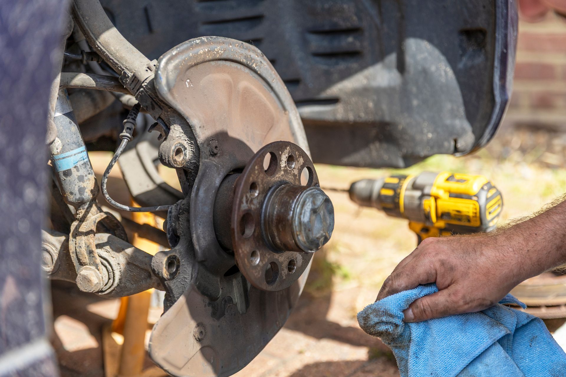 Technician Completing Mobile Brake Service And Repair | TireXpress Mobile Tire & Auto Repair