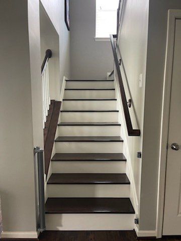 A set of stairs leading up to the second floor of a house.