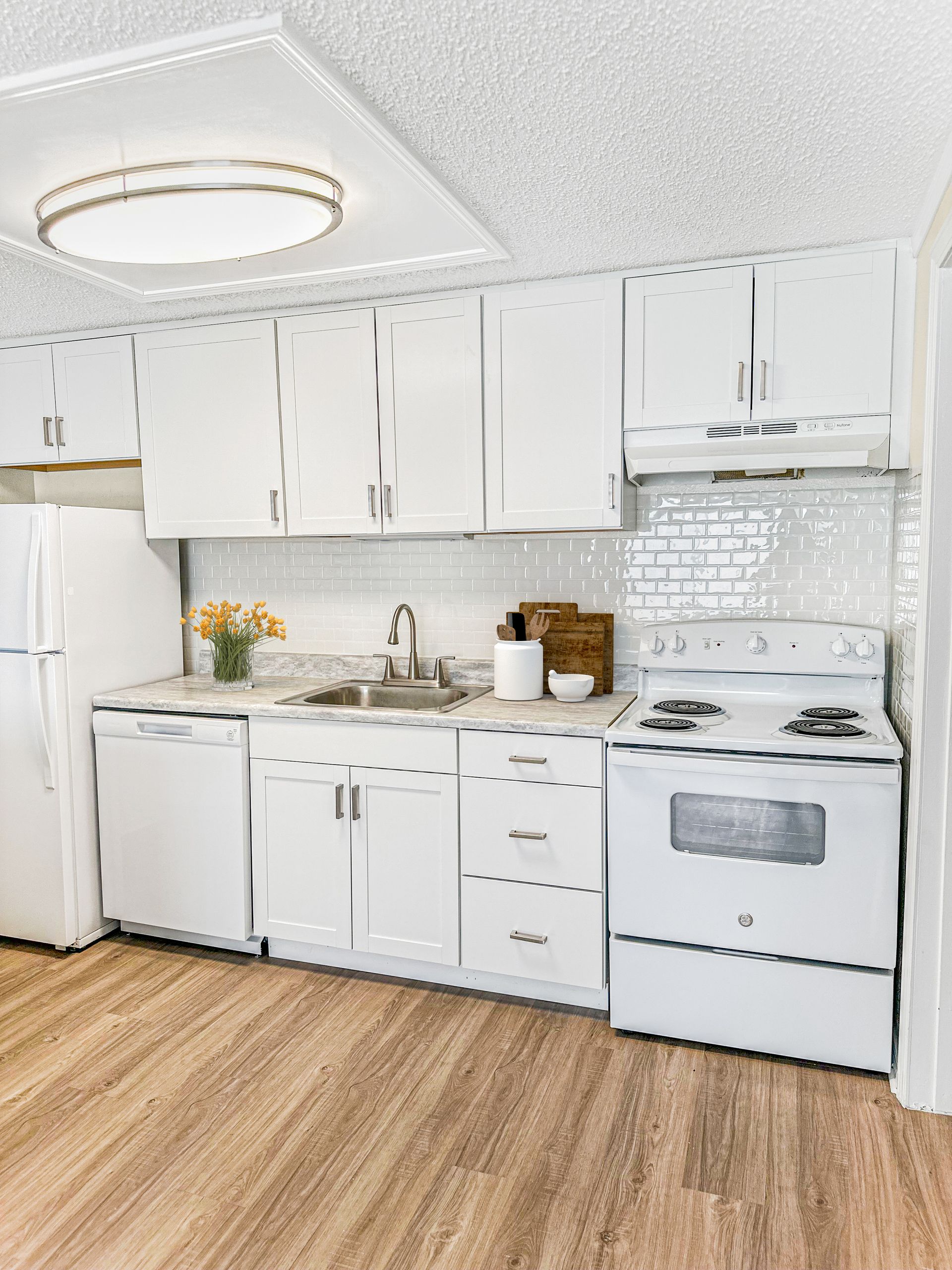 Photo of the kitchen with plenty of cabinetry