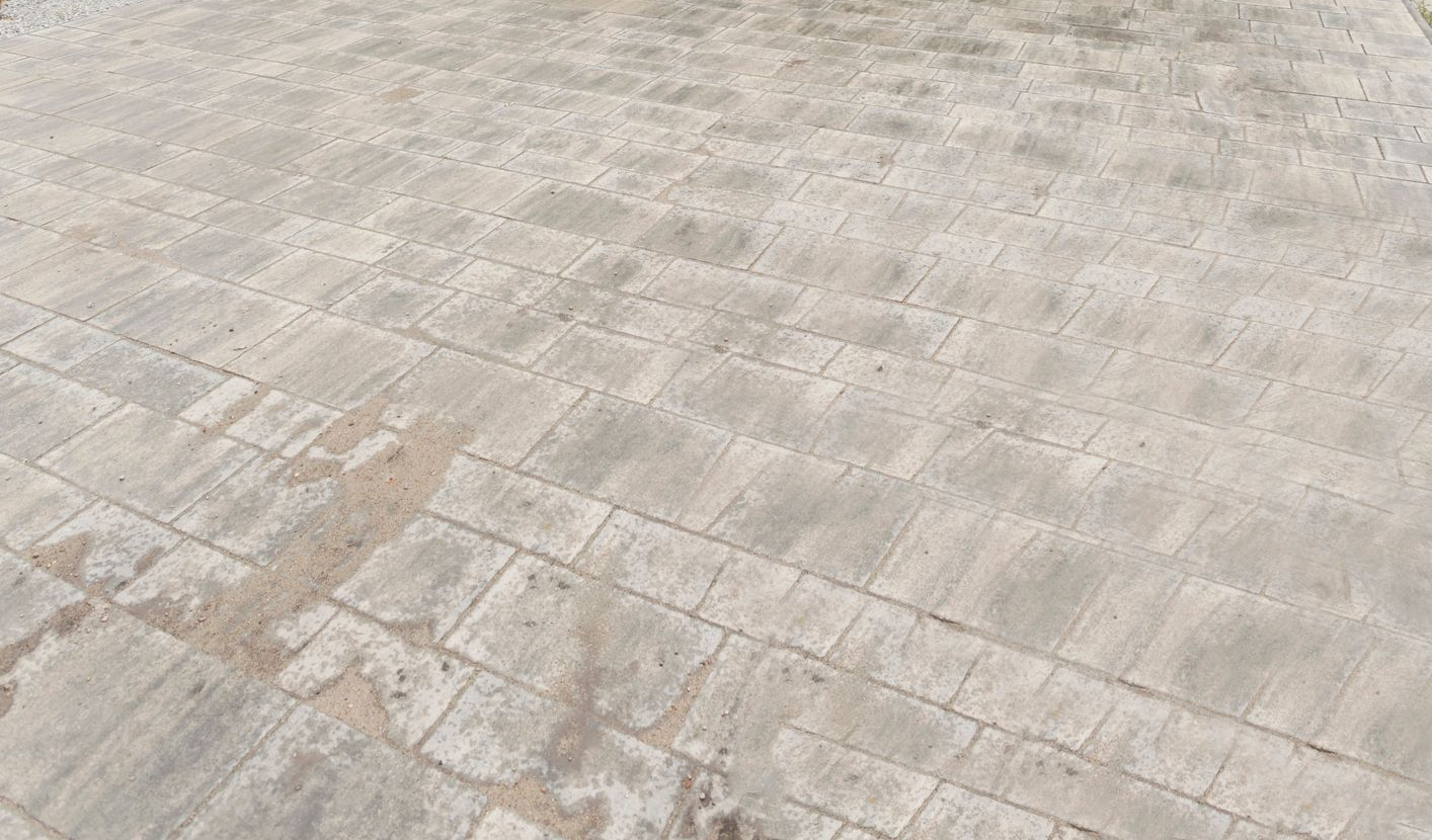 Light gray stone-tiled pavement with a subtle diagonal pattern