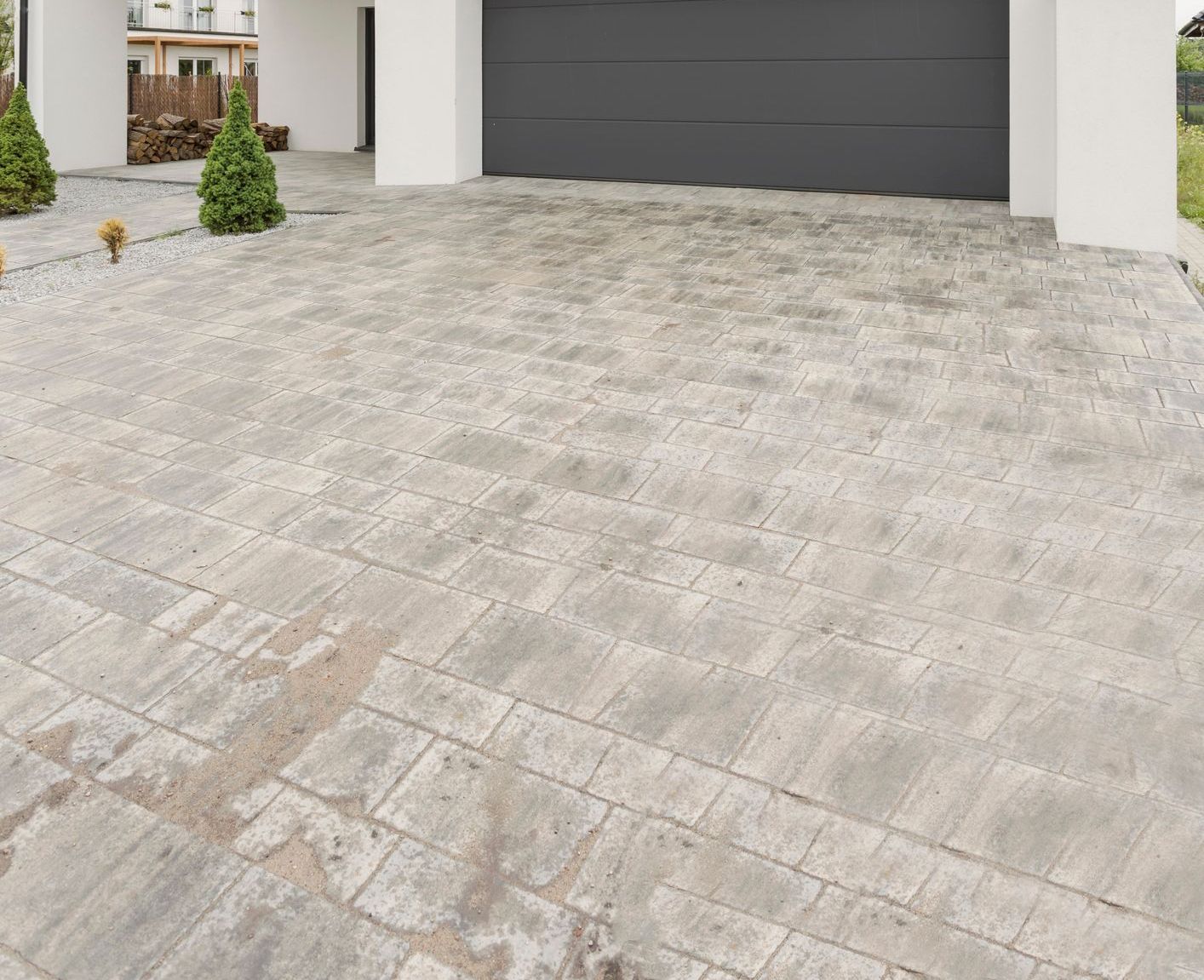 gray brick stamped concrete driveway